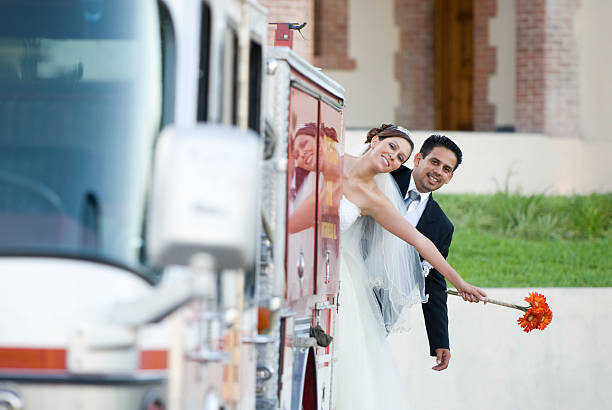 couple just married enjoy the ride in wedding party bus